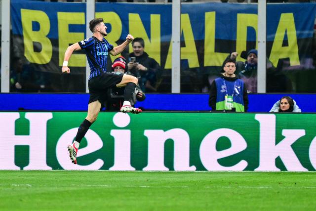 Inter Milan's Croatian midfielder #8 Petar Sucic celebrates after scoring his team first goal during the UEFA Champions League, league phase day 7, football match between Inter Milan and Arsenal at San Siro stadium in Milan, northern Italy, on January 20, 2026. (Photo by Stefano RELLANDINI / AFP)