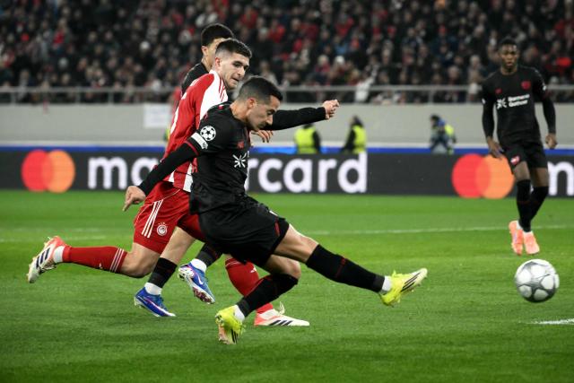Bayer Leverkusen's Spanish defender #21 Lucas Vazquez shoots on target during the during the UEFA Champions League, league phase day 7, football match between Olympiakos and Bayer Leverkusen at the Georgios Karaiskakis Stadium in Piraeus, near Athens, on January 20, 2026. (Photo by Angelos Tzortzinis / AFP)