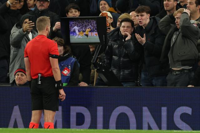 Swedish referee Glenn Nyberg checks the pitch-side monitor before sending off Dortmund's Swedish defender #24 Daniel Svensson during the UEFA Champions League football league stage match between Tottenham Hotspur and Borussia Dortmund at the Tottenham Hotspur Stadium in London, on January 20, 2026. (Photo by Adrian Dennis / AFP)