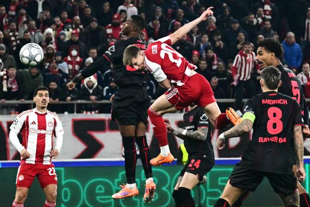 Olympiakos' Portuguese defender #20 Costinha heads the ball and score his team's first goal during the during the UEFA Champions League, league phase day 7, football match between Olympiakos and Bayer Leverkusen at the Georgios Karaiskakis Stadium in Piraeus, near Athens, on January 20, 2026. (Photo by Aggelos NAKKAS / AFP)