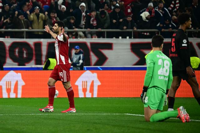 Olympiakos' Iranian forward #99 Mehdi Taremi celebrates scoring his team's second goal during the during the UEFA Champions League, league phase day 7, football match between Olympiakos and Bayer Leverkusen at the Georgios Karaiskakis Stadium in Piraeus, near Athens, on January 20, 2026. (Photo by Aggelos NAKKAS / AFP)
