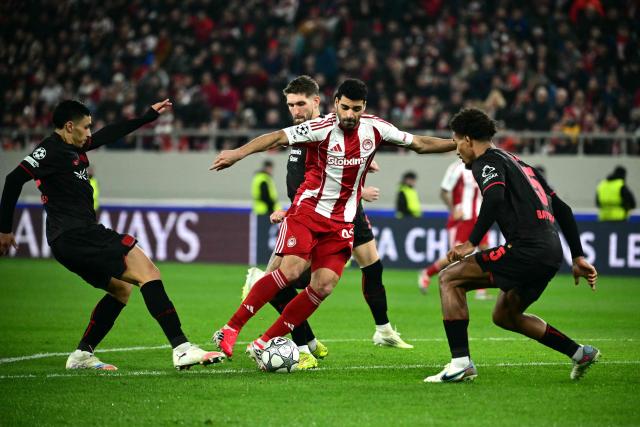 Olympiakos' Iranian forward #99 Mehdi Taremi dribbles during the during the UEFA Champions League, league phase day 7, football match between Olympiakos and Bayer Leverkusen at the Georgios Karaiskakis Stadium in Piraeus, near Athens, on January 20, 2026. (Photo by Angelos Tzortzinis / AFP)