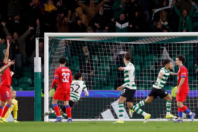 Sporting Lisbon's Colombian forward #97 Luis Suarez (2R) celebrates scoring the opening goal during the UEFA Champions League league phase day 7 football match between Sporting CP and Paris Saint Germain at Jose Alvalade stadium in Lisbon on January 20, 2026. (Photo by FILIPE AMORIM / AFP)