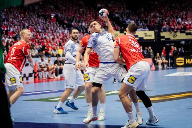 Portugal's right back #26 Francisco Costa plays the ball during the EHF Euro 2026 Group B preliminary round handball match between Denmark and Portugal in Herning, Denmark, on January 20, 2026. (Photo by Sebastian Elias Uth / Ritzau Scanpix / AFP) / Denmark OUT