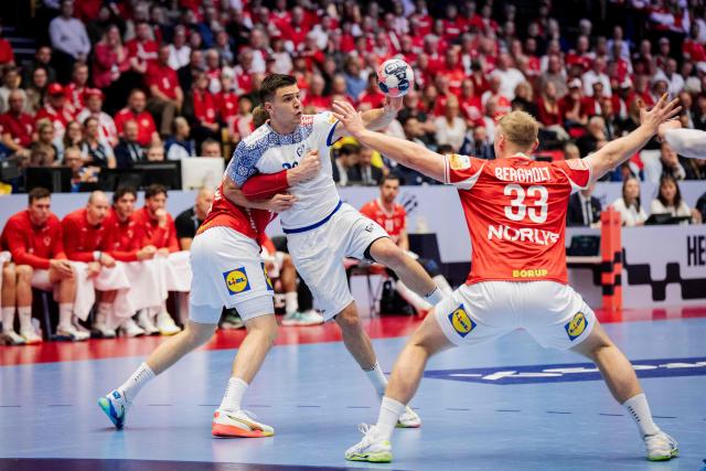 Portugal's right back #26 Francisco Costa plays the ball during the EHF Euro 2026 Group B preliminary round handball match between Denmark and Portugal in Herning, Denmark, on January 20, 2026. (Photo by Sebastian Elias Uth / Ritzau Scanpix / AFP) / Denmark OUT
