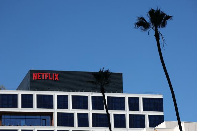 (FILES) The Netflix logo is pictured at the company’s Hollywood studio offices at Sunset Bronson Studios in Los Angeles, California on December 5, 2025. Netflix shares fell more than five percent on January 20, 2026 as the streaming entertainment giant said it expected revenue to be essentially flat in the current quarter after years of growth. (Photo by Patrick T. Fallon / AFP)