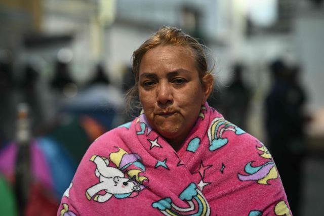 A relative waits for news on their beloved ones, outside of the Zone 7 of the Bolivarian National Police (PNB), also known as the Boleita Detention and Custody Center, in the municipality of Sucre, Caracas Metropolitan District (DMC) on January 20, 2026. Venezuela said January 12, it had freed dozens more political prisoners as rights groups questioned the numbers and family members clamored for speedier releases after the US military ouster of long-term autocrat Nicolas Maduro. (Photo by RONALDO SCHEMIDT / AFP)