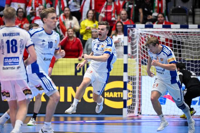 Iceland's Ooinn Rikharosson (C) celebrates after scoring a goal during the EHF Euro 2026 Group F preliminary round handball match between Hungary and Iceland in Kristianstad, Sweden, on January 20, 2026. (Photo by Johan Nilsson/TT / TT News Agency / AFP) / Sweden OUT