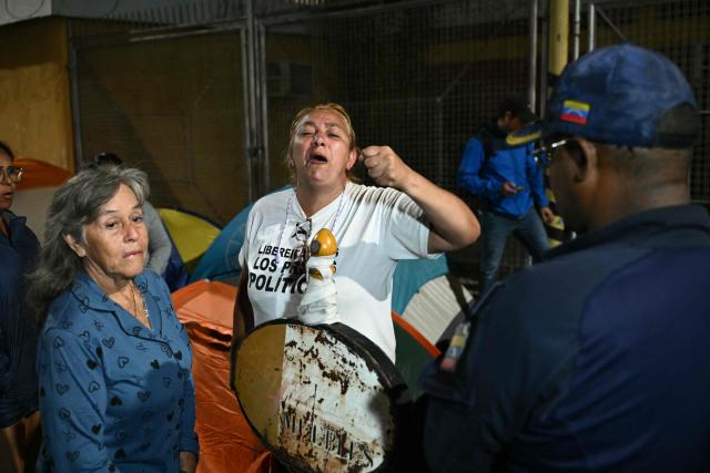 The mother of prisoner Jack Tantak Cano, Evelis Cano (C), gestures as she waits for news outside of the Zone 7 of the Bolivarian National Police (PNB), also known as the Boleita Detention and Custody Center, in the municipality of Sucre, Caracas, on January 20, 2026. Venezuelan opposition leader Maria Corina Machado said on January 20 that change in her country after the US ouster of Nicolas Maduro can come only with the release of political prisoners. (Photo by RONALDO SCHEMIDT / AFP)