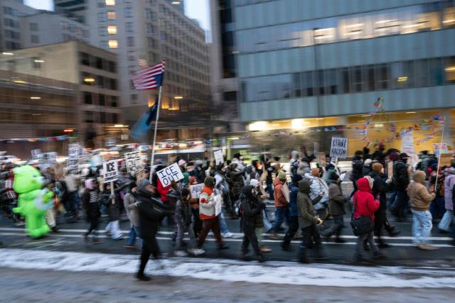 People take part in the nationwide "Stop ICE Terror" rally in downtown Minneapolis, Minnesota, on January 20, 2026 in protest against US President Donald Trump's policies. (Photo by ROBERTO SCHMIDT / AFP)