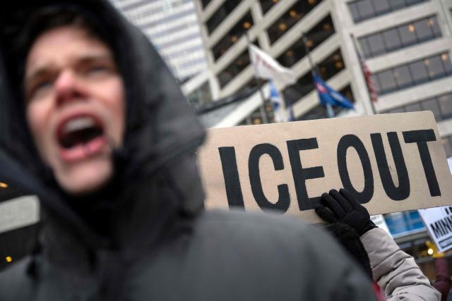 A demonstrator shouts slogans as he takes part in the nationwide "Stop ICE Terror" rally in downtown Minneapolis, Minnesota, on January 20, 2026 in protest against US President Donald Trump's policies. (Photo by ROBERTO SCHMIDT / AFP)
