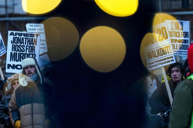 Demonstrators march during the nationwide "Stop ICE Terror" rally through downtown Minneapolis, Minnesota, on January 20, 2026 in protest against US President Donald Trump's policies. (Photo by ROBERTO SCHMIDT / AFP)