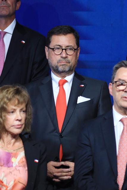 Chile's new Minister of Foreign Affairs Francisco Perez Mackenna looks on during the presentation of the cabinet of President-elect Jose Antonio Kast at the office of the president-elect, commonly nicknamed 'La Moneda Chica,' in Las Condes, Santiago, on January 20, 2026. Chile's right-wing president-elect Jose Antonio Kast on January 20 named two ex-lawyers of former dictator Augusto Pinochet to lead the ministries of defense and human rights when he takes office in March. (Photo by Alvaro NARANJO / AFP)
