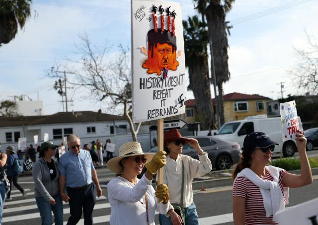People march during the Free America Walkout to protest against US President Donald Trump's policies in the Venice Beach neighborhood of Los Angeles, California on January 20, 2026. (Photo by Patrick T. Fallon / AFP)
