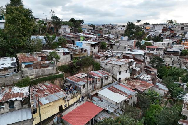 This aerial view shows the Nueva Jerusalen neighborhood during the state of emergency declared by the government in Guatemala City on January 20, 2026. Guatemalan soldiers began patrolling gang-controlled neighborhoods in the capital on Tuesday, after attacks that left ten police officers dead and prompted the government to declare a state of siege, according to official sources and an AFP journalist. (Photo by JOHAN ORDONEZ / AFP)
