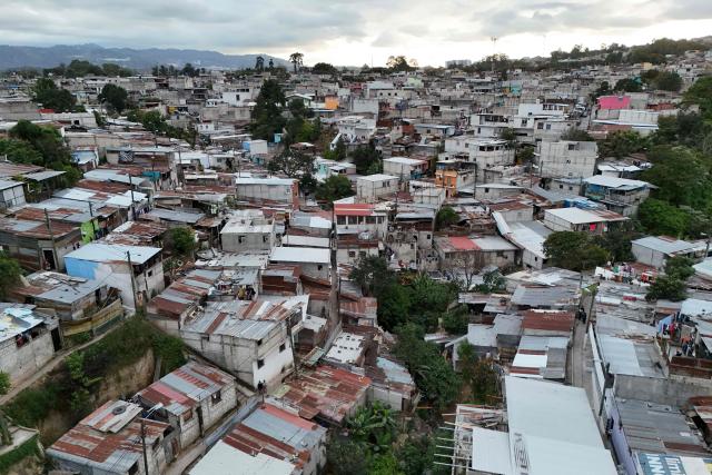 This aerial view shows the Nueva Jerusalen neighborhood during the state of emergency declared by the government in Guatemala City on January 20, 2026. Guatemalan soldiers began patrolling gang-controlled neighborhoods in the capital on Tuesday, after attacks that left ten police officers dead and prompted the government to declare a state of siege, according to official sources and an AFP journalist. (Photo by JOHAN ORDONEZ / AFP)