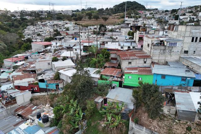 This aerial view shows the Nueva Jerusalen neighborhood during the state of emergency declared by the government in Guatemala City on January 20, 2026. Guatemalan soldiers began patrolling gang-controlled neighborhoods in the capital on Tuesday, after attacks that left ten police officers dead and prompted the government to declare a state of siege, according to official sources and an AFP journalist. (Photo by JOHAN ORDONEZ / AFP)