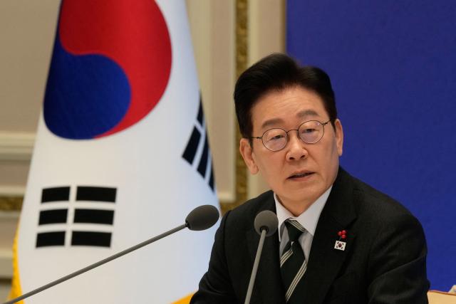 South Korean President Lee Jae Myung speaks during his new year press conference at the presidential Blue House in Seoul on January 21, 2026. (Photo by Ahn Young-joon / POOL / AFP)
