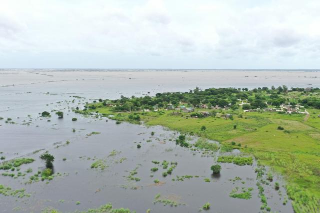 This aerial view shows floodwater caused by heavy rains near Maputo on January 20, 2026. At least 114 people have died since the rainy season began in early October 2025, including 51 since Christmas Eve, when downpours intensified and sent torrents of river water crashing through several villages.
The United Nations says the surging waters have spiralled into a rapidly escalating emergency. (Photo by Emidio JOZINE / AFP)