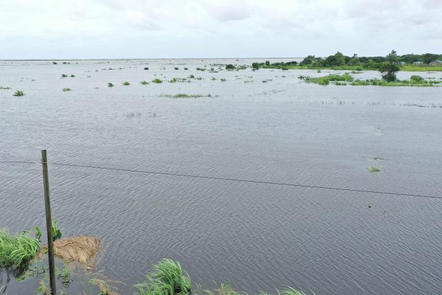 This aerial view shows floodwater caused by heavy rains near Maputo on January 20, 2026. At least 114 people have died since the rainy season began in early October 2025, including 51 since Christmas Eve, when downpours intensified and sent torrents of river water crashing through several villages.
The United Nations says the surging waters have spiralled into a rapidly escalating emergency. (Photo by Emidio JOZINE / AFP)