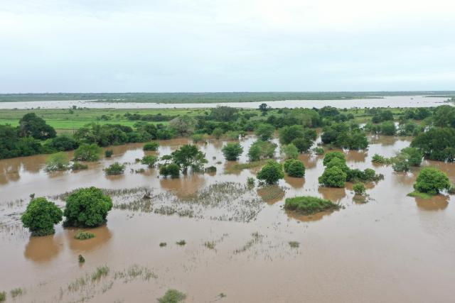 This aerial view shows floodwater caused by heavy rains near Maputo on January 20, 2026. At least 114 people have died since the rainy season began in early October 2025, including 51 since Christmas Eve, when downpours intensified and sent torrents of river water crashing through several villages.
The United Nations says the surging waters have spiralled into a rapidly escalating emergency. (Photo by Emidio JOZINE / AFP)
