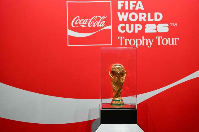 The FIFA World Cup Trophy is displayed on a stage during the trophy tour ahead of the 2026 FIFA World Cup, which will take place in the United States, Canada, and Mexico, at a shopping mall in Kuala Lumpur on January 21, 2026. (Photo by Mohd RASFAN / AFP)