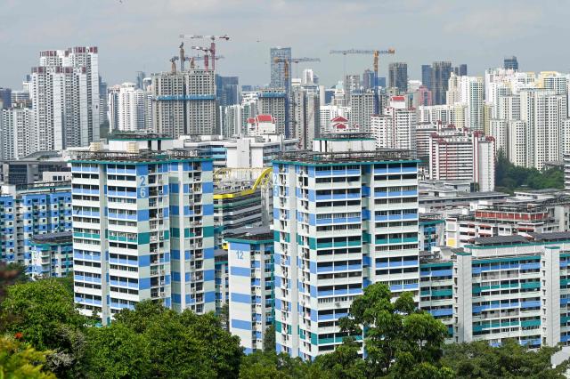Under construction highrise housing apartments are seen in Singapore on January 21, 2026. (Photo by Roslan RAHMAN / AFP)