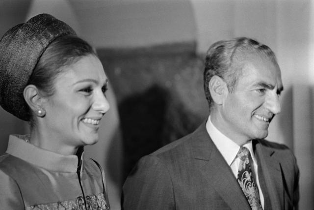 (FILES) The Shah of Iran, Mohammad Reza Pahlavi (R), and Empress Farah Diba smile on October 17, 1971 in Persepolis during the official dinner held under a tent on the occasion of the 2500th anniversary of the founding of the persian Empire celebration. Farah Pahlavi, the widow of Iran’s former shah, told AFP on January 21, 2026, there was “no turning back” after a wave of protests against the country’s clerical authorities, saying she is convinced the Iranian people will emerge as the “victors”. (Photo by Jean-Pierre PREVEL / AFP)