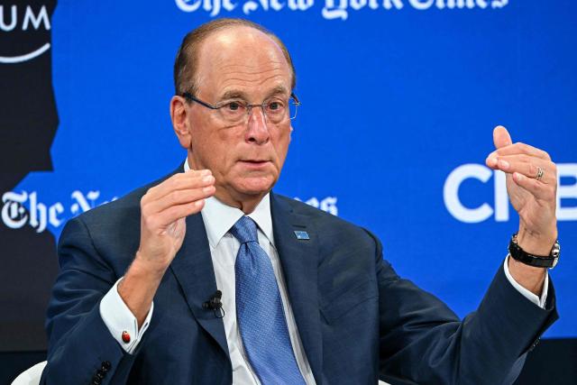 BlackRock chairman and WEF interim co-chair Larry Fink gestures as he speaks during the World Economic Forum (WEF) annual meeting in Davos on January 21, 2026. The World Economic Forum takes place in Davos from January 19 to January 23, 2026. (Photo by Fabrice COFFRINI / AFP)