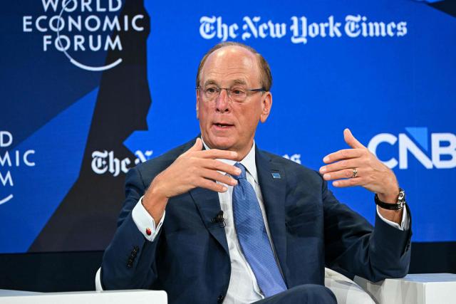 BlackRock chairman and WEF interim co-chair Larry Fink gestures as he speaks during the World Economic Forum (WEF) annual meeting in Davos on January 21, 2026. The World Economic Forum takes place in Davos from January 19 to January 23, 2026. (Photo by Fabrice COFFRINI / AFP)
