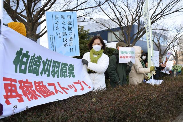 Residents protest against the restart of Tokyo Electric Power Company's Kashiwazaki-Kariwa nuclear power plant in Niigata, Niigata Prefecture on January 21, 2026. The world's biggest nuclear power plant was restarted January 21, 2026 for the first time since the 2011 Fukushima disaster, its Japanese operator said, despite persistent safety concerns among residents. (Photo by JIJI Press / AFP) / Japan OUT