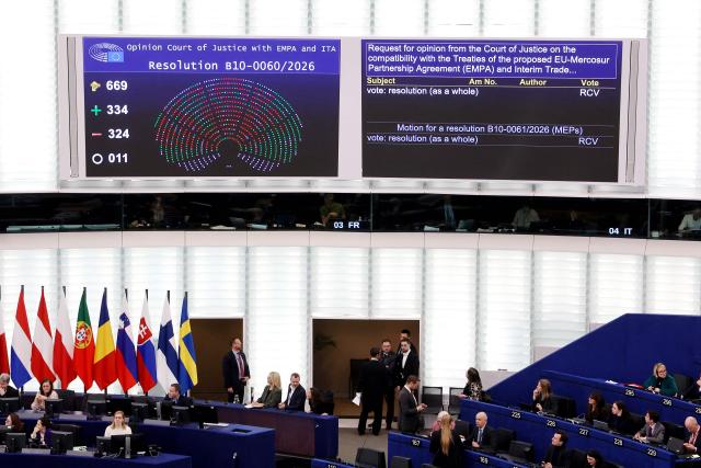 TOPSHOT - This photograph shows screens displaying the results of the vote on the legal referral concerning the Mercosur deal, during a voting session at the European Parliament in Strasbourg, eastern France, on January 21, 2026. The European Union's parliament voted on January 21, 2026 to refer a freshly signed trade deal with South American bloc Mercosur to the EU's top court, casting a veil of legal uncertainty over the accord. (Photo by FREDERICK FLORIN / AFP)