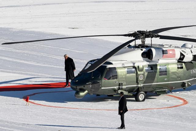 US President Donald Trump stepps out of Marine One helicopter at Davos Landing Zone to attend the World Economic Forum (WEF) annual meeting on January 21, 2026. The World Economic Forum takes place in Davos from January 19 to January 23, 2026. (Photo by INA FASSBENDER / AFP)