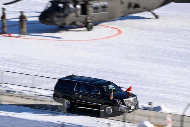 US President Donald Trump leaves by car the Davos Landing Zone in Davos prior to attend the World Economic Forum (WEF) annual meeting on January 21, 2026. The World Economic Forum takes place in Davos from January 19 to January 23, 2026. (Photo by INA FASSBENDER / AFP)