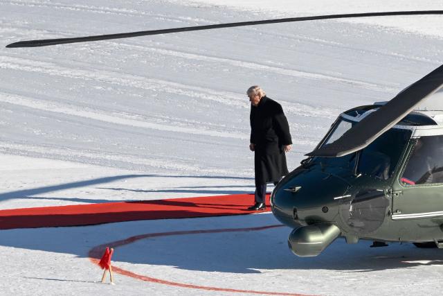 US President Donald Trump stepps out of Marine One helicopter at Davos Landing Zone to attend the World Economic Forum (WEF) annual meeting on January 21, 2026. The World Economic Forum takes place in Davos from January 19 to January 23, 2026. (Photo by INA FASSBENDER / AFP)