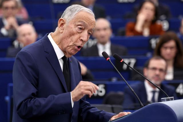 Portuguese President Marcelo Rebelo de Sousa delivers a speech to members of European Parliament during a formal sitting for the 40th anniversary of Spain and Portugal joining the EU  with the EU flag in the background in Strasbourg, eastern France, on January 21, 2026. (Photo by FREDERICK FLORIN / AFP)