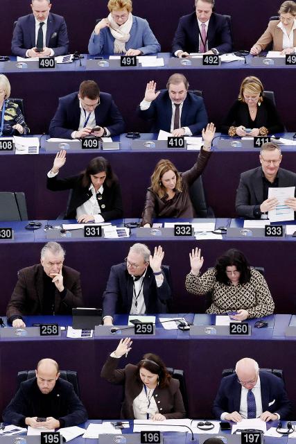 Members of the European Parliament take part in a voting session during a plenary session at the European Parliament in Strasbourg, eastern France, on January 21, 2026. (Photo by FREDERICK FLORIN / AFP)