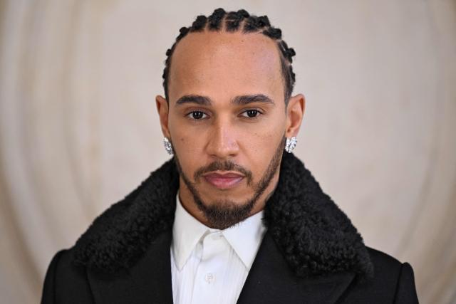 British formula one driver Lewis Hamilton poses for a photocall ahead of the Dior Menswear Ready-to-wear Fall-Winter 2026/2027 collection as part of the Men Paris Fashion Week in Paris on January 21, 2026.  (Photo by Blanca CRUZ / AFP)