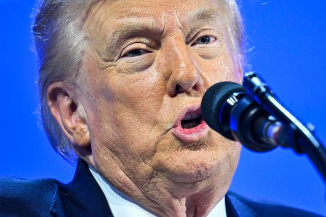 US President Donald Trump delivers a special address during the World Economic Forum (WEF) annual meeting in Davos on January 21, 2026. The World Economic Forum takes place in Davos from January 19 to January 23, 2026. (Photo by Mandel NGAN / AFP)