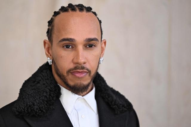 British formula one driver Lewis Hamilton poses for a photocall ahead of the Dior Menswear Ready-to-wear Fall-Winter 2026/2027 collection as part of the Men Paris Fashion Week in Paris on January 21, 2026.  (Photo by Blanca CRUZ / AFP)