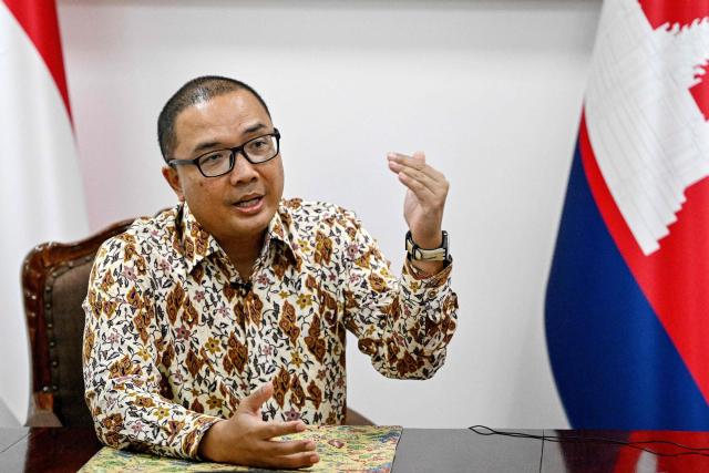 Indonesian Ambassador to Cambodia Santo Darmosumarto speaks during an interview with AFP at the Indonesian Embassy in Phnom Penh on January 21, 2026. More than 1,400 Indonesians have left cyberscam networks in Cambodia in the last five days, Jakarta said on January 21, after Phnom Penh pledged a fresh crackdown on the illicit trade. (Photo by TANG CHHIN Sothy / AFP)