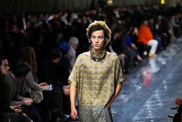 A model presents a creation by Dior for the Menswear Ready-to-wear Fall-Winter 2026/2027 collection as part of the Men Paris Fashion Week in Paris on January 21, 2026.  (Photo by Blanca CRUZ / AFP)