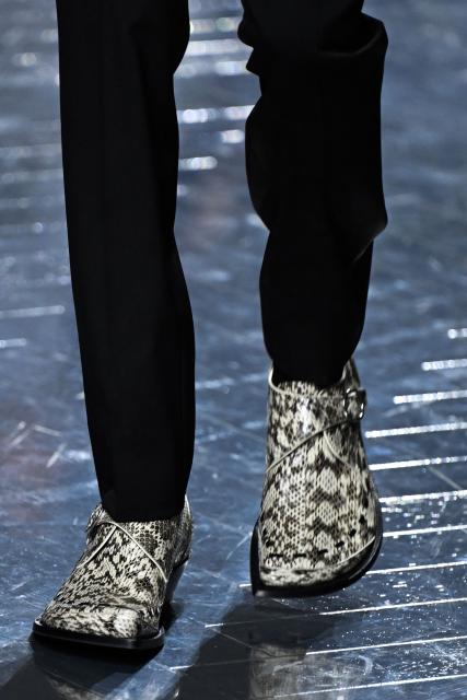 A model presents a creation by Dior for the Menswear Ready-to-wear Fall-Winter 2026/2027 collection as part of the Men Paris Fashion Week in Paris on January 21, 2026.  (Photo by Blanca CRUZ / AFP)