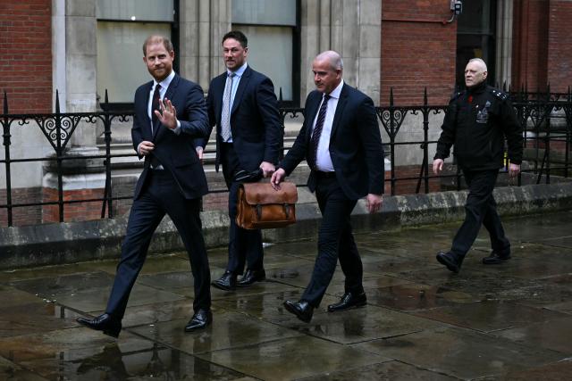 Britain's Prince Harry waves as he departs the High Court in London on January 21, 2026, following the third day of the trial in his case against a major UK newspaper group. Prince Harry on January 21 took the stand at a court in London as the first witness called in his joint claim that two UK tabloid newspapers unlawfully gathered information about him. (Photo by JUSTIN TALLIS / AFP)
