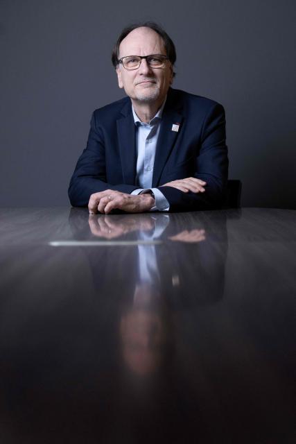 French pharmacist, biologist and Director of Institut Curie's Research Center Alain Puisieux, poses for photographs during a portrait session in his office, in Paris, on January 21, 2026. (Photo by JOEL SAGET / AFP)