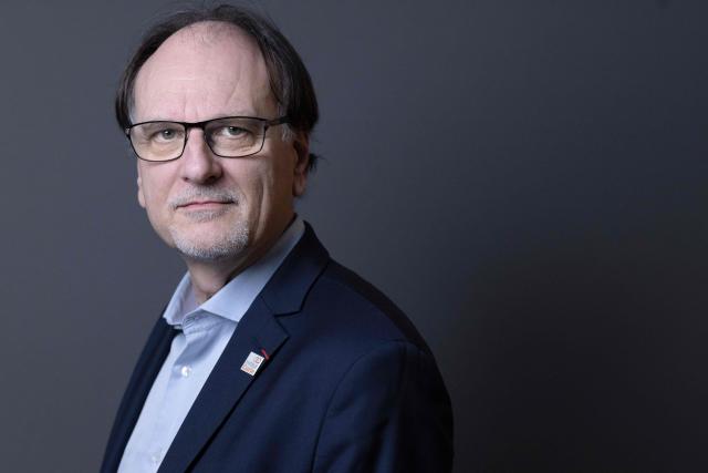 French pharmacist, biologist and Director of Institut Curie's Research Center Alain Puisieux, poses for photographs during a portrait session in his office, in Paris, on January 21, 2026. (Photo by JOEL SAGET / AFP)