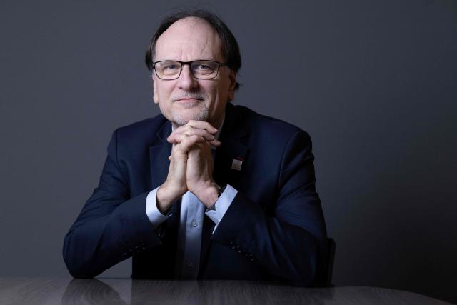 French pharmacist, biologist and Director of Institut Curie's Research Center Alain Puisieux, poses for photographs during a portrait session in his office, in Paris, on January 21, 2026. (Photo by JOEL SAGET / AFP)