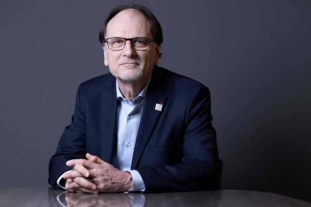 French pharmacist, biologist and Director of Institut Curie's Research Center Alain Puisieux, poses for photographs during a portrait session in his office, in Paris, on January 21, 2026. (Photo by JOEL SAGET / AFP)