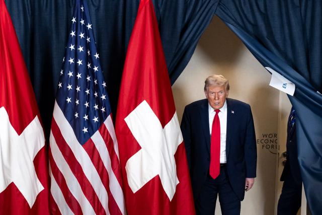 US President Donald Trump arrives for a bilateral meeting with Switzerland's President on the sidelines of the World Economic Forum (WEF) annual meeting in Davos on January 21, 2026. The World Economic Forum is taking place in Davos from January 19 to January 23, 2026. (Photo by LAURENT GILLIERON / POOL / AFP)
