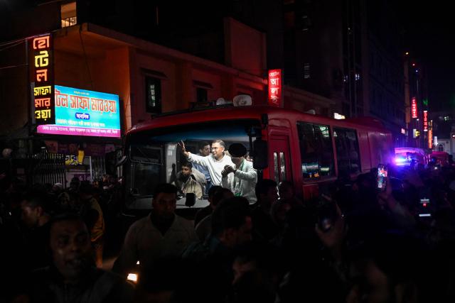 Bangladesh Nationalist Party (BNP) chairman Tarique Rahman waves to supporters from a vehicle after visiting the shrine of Sufi saint Hazrat Shahjalal in Sylhet on January 21, 2026, as part of the official launch of his election campaign. (Photo by Munir UZ ZAMAN / AFP)